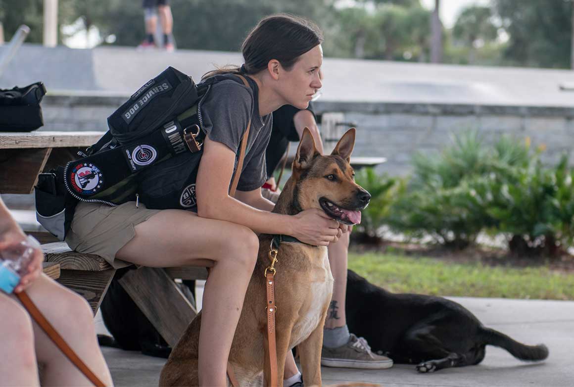 K9s For Warriors graduate Sarah with service dog Major