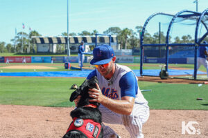Pete Alonso meets Service Dog in training Bear. 