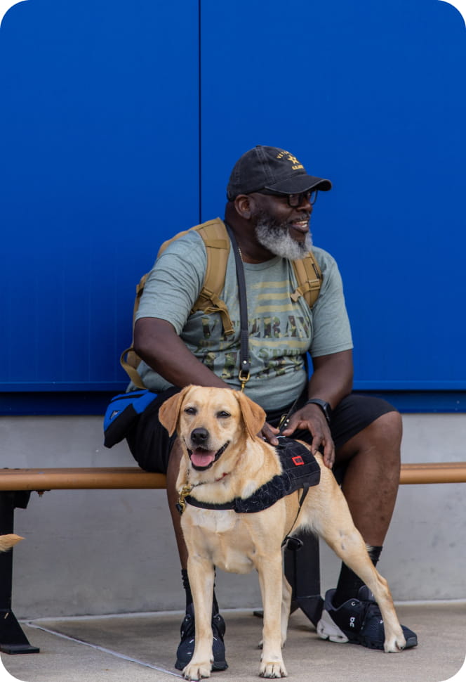 Man on a bench with dog,